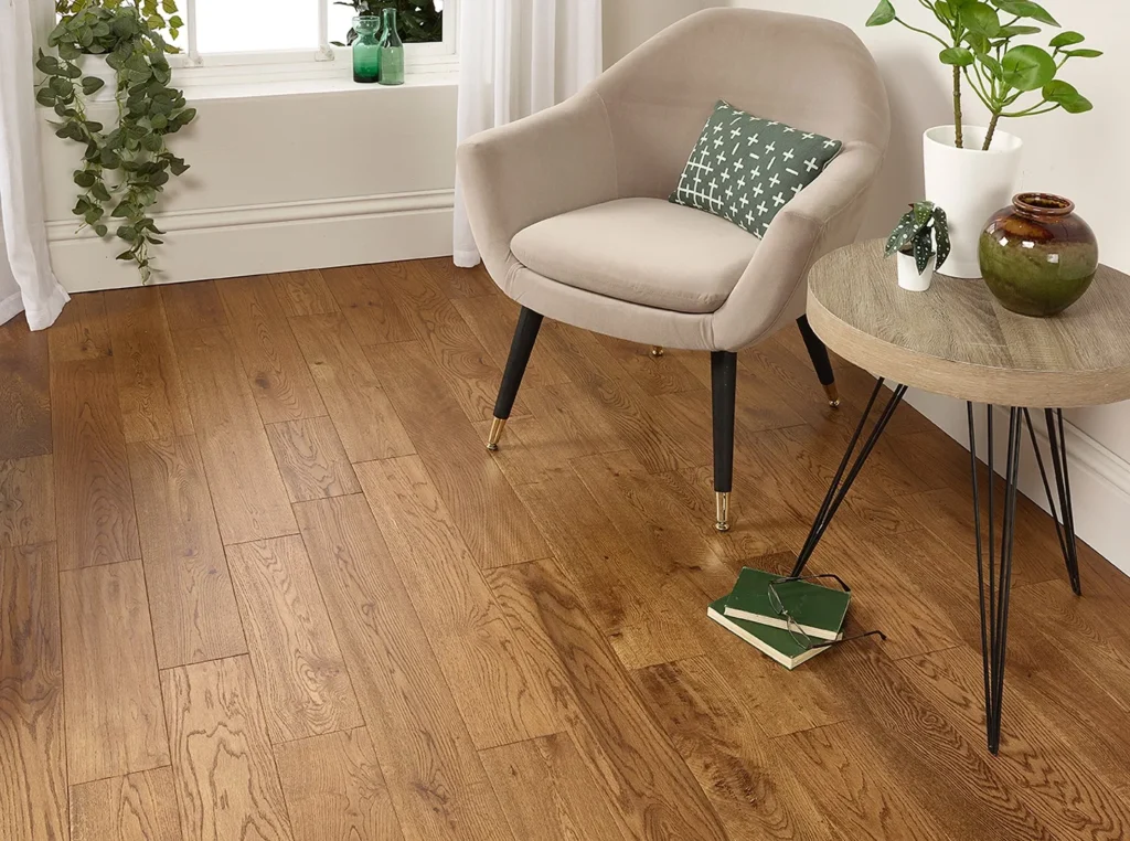 Cozy room with chair and wooden flooring.