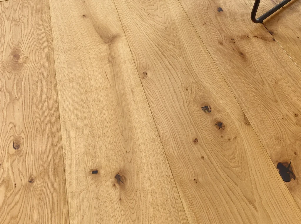 Wooden floor with natural grain and knots.