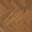 Herringbone-patterned wooden floor texture.