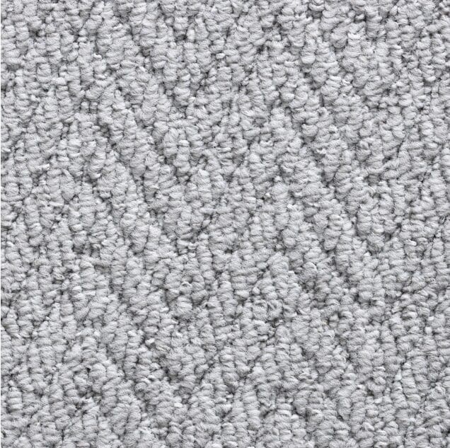 Gray textured herringbone pattern carpet close-up.