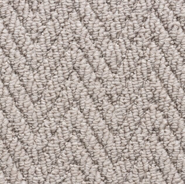 Textured beige carpet with chevron pattern.