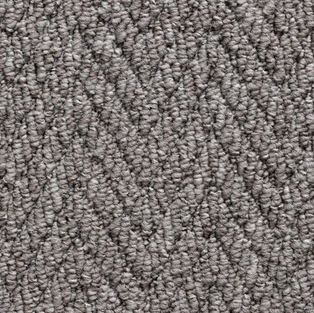 Textured gray carpet with zigzag pattern.
