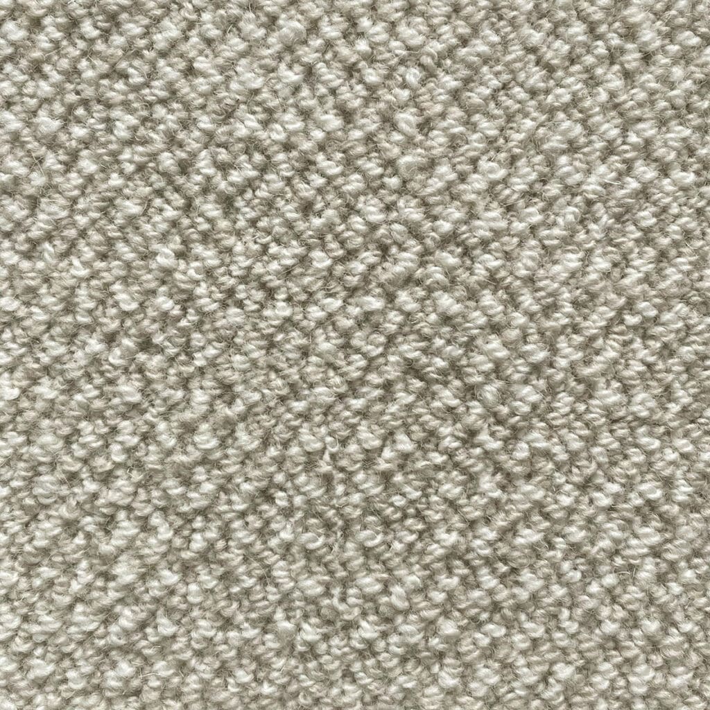 Beige textured carpet with looped fibers.