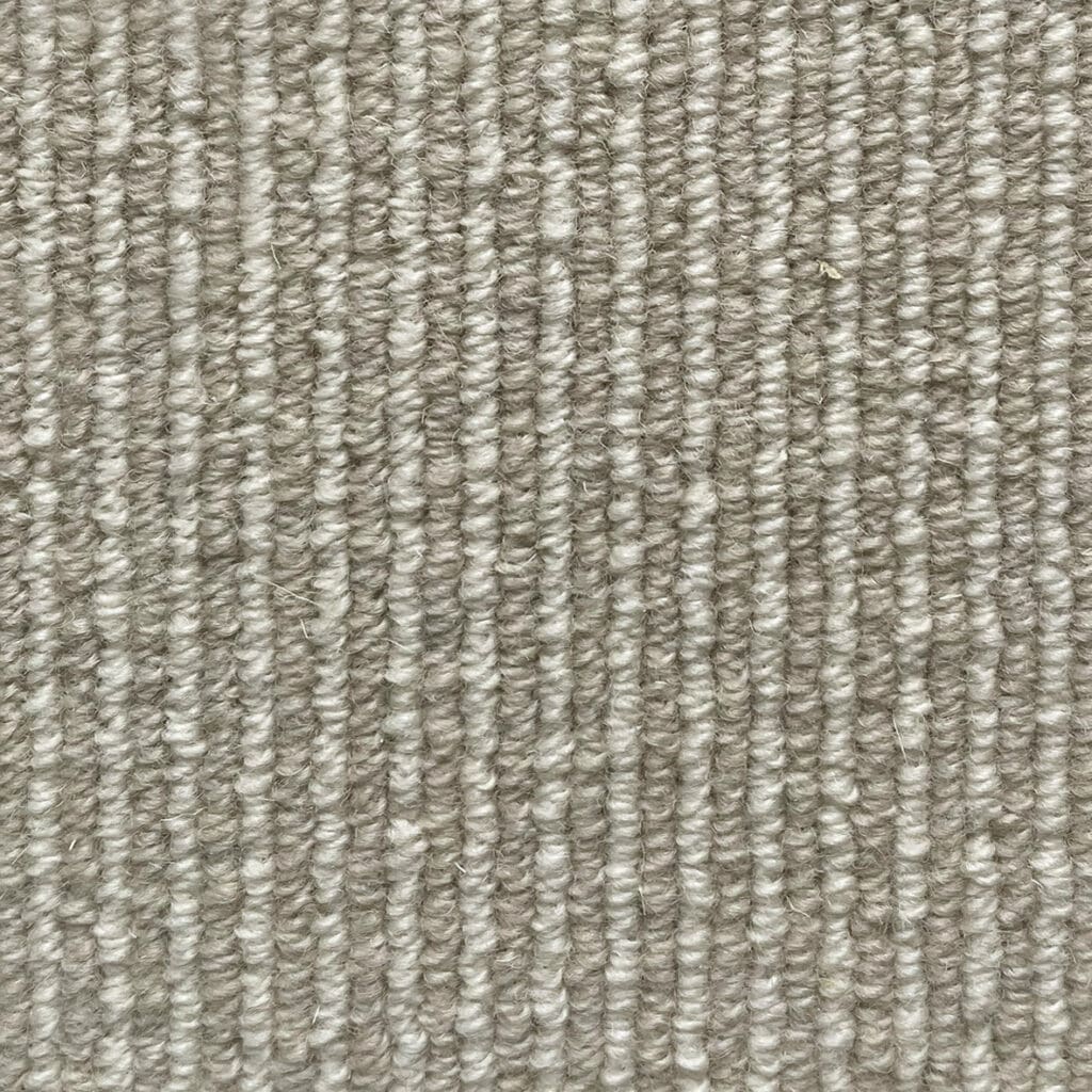 Gray textured carpet with vertical lines.