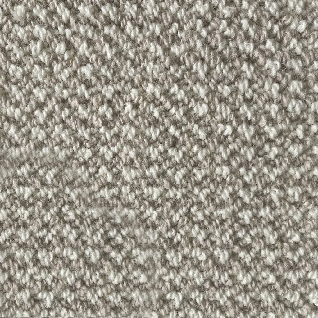 Close-up of textured beige carpet fabric.