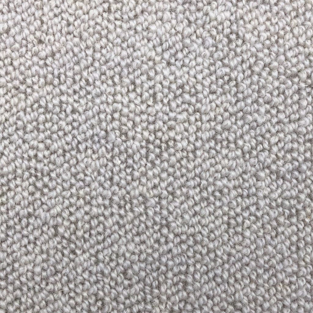 Close-up of beige textured carpet material.