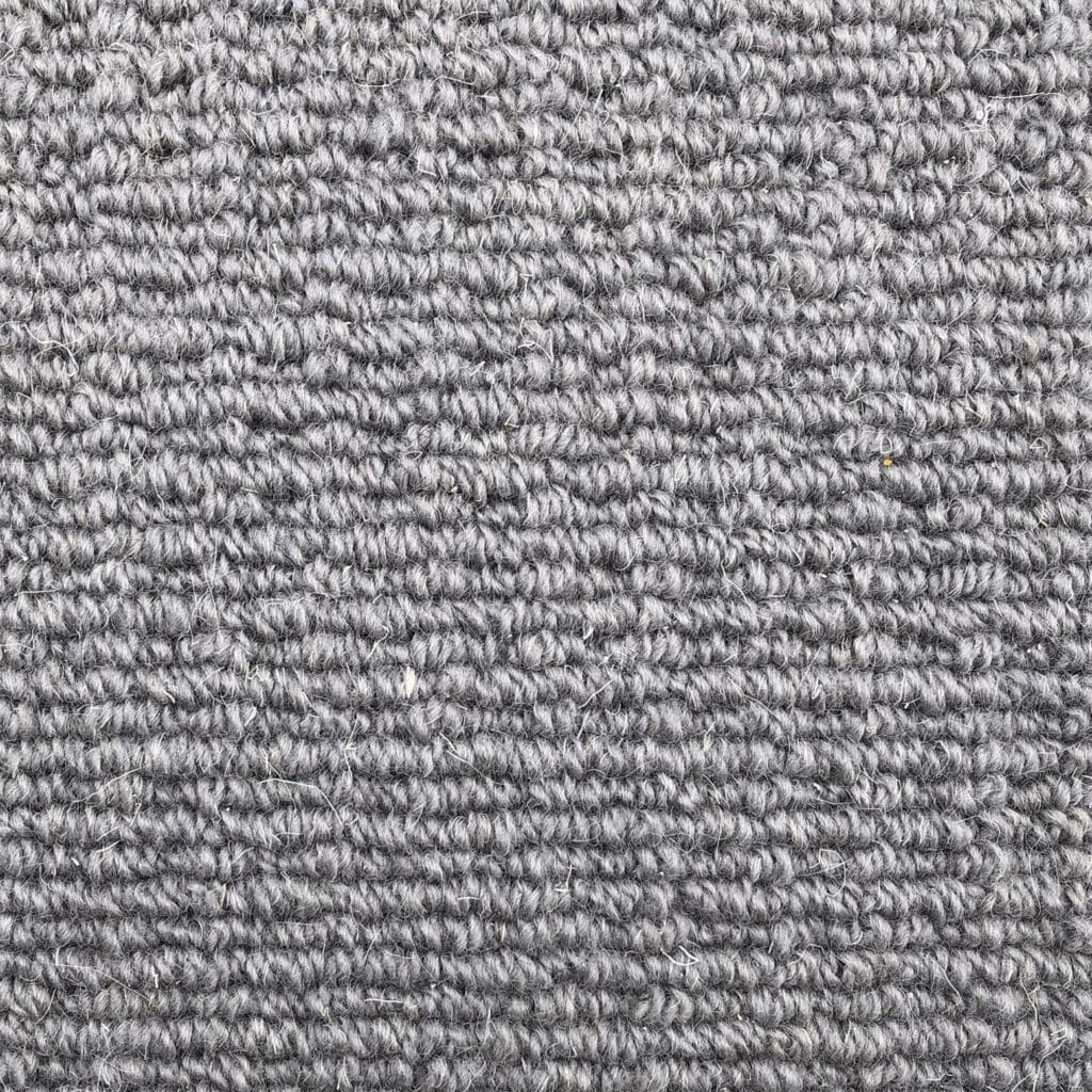 Gray textured carpet with looped pattern.