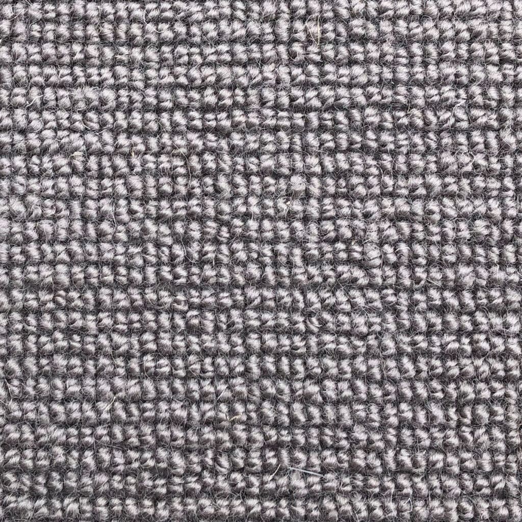 Gray textured carpet fabric close-up.