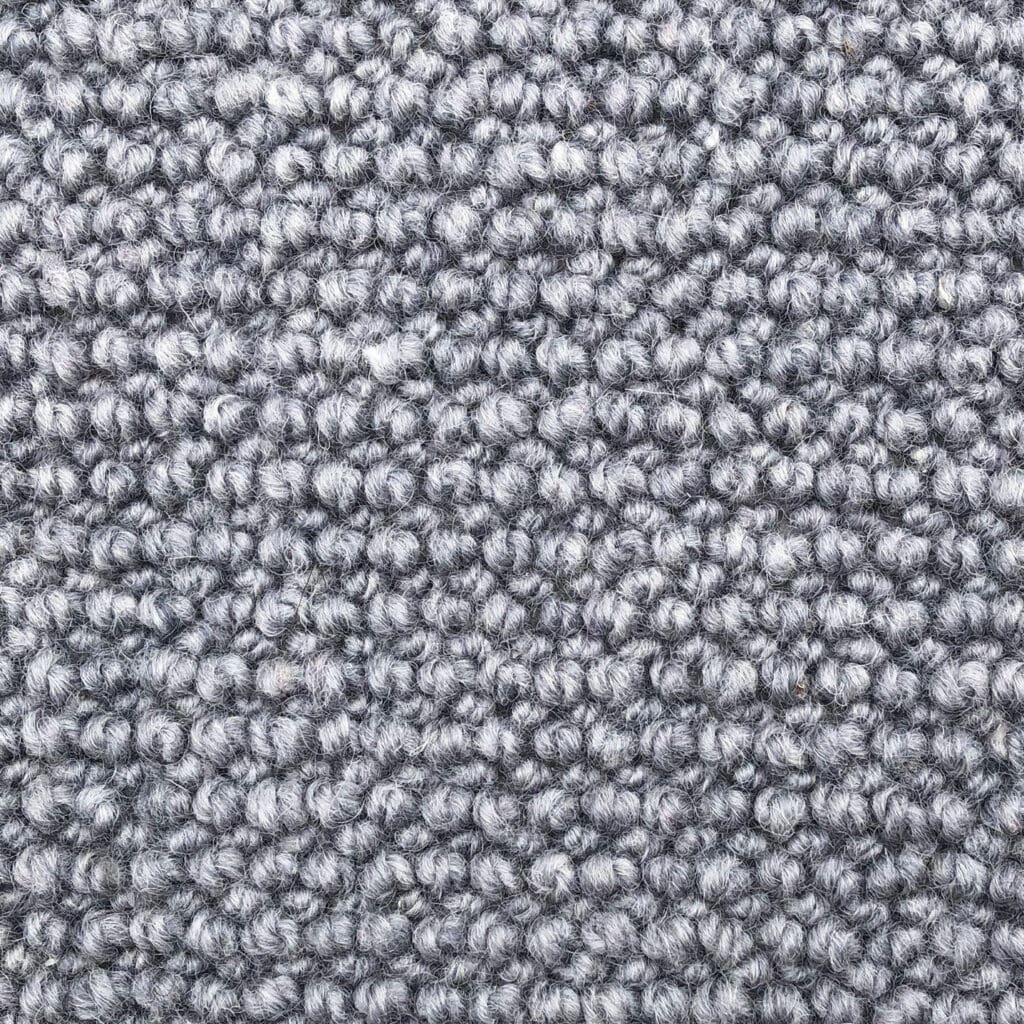 Gray textured carpet with looped pile design.