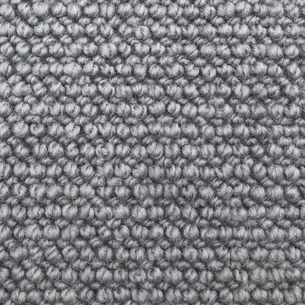 Close-up of grey textured carpet fabric.