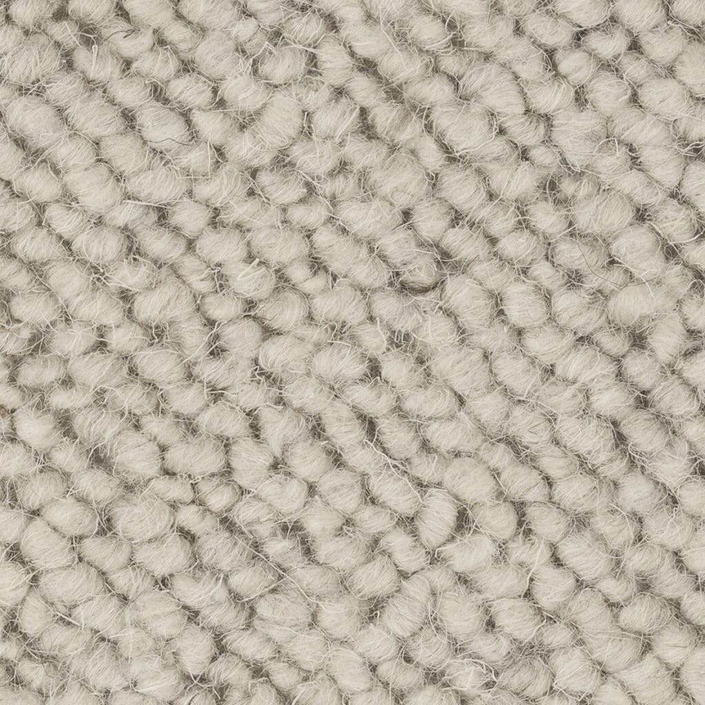 Close-up of textured beige woven fabric.