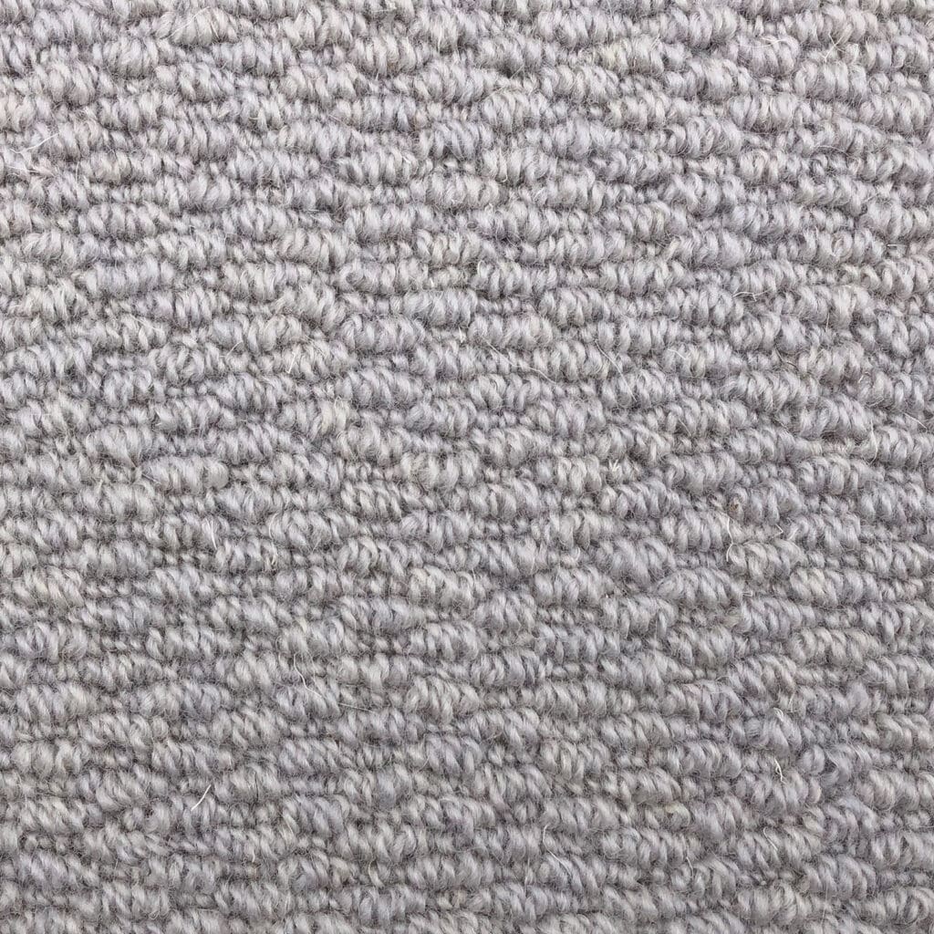 Gray carpet with textured loop pattern.