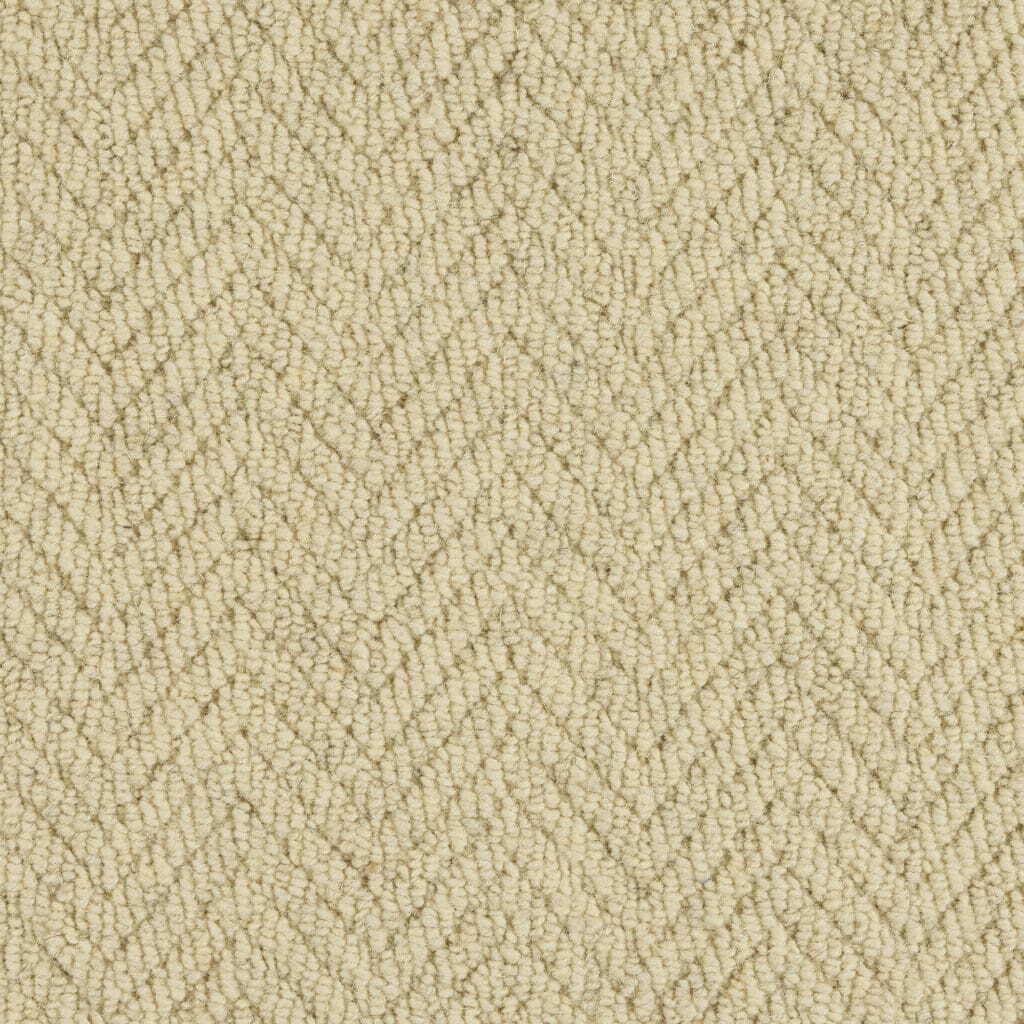 Beige herringbone textured fabric pattern.