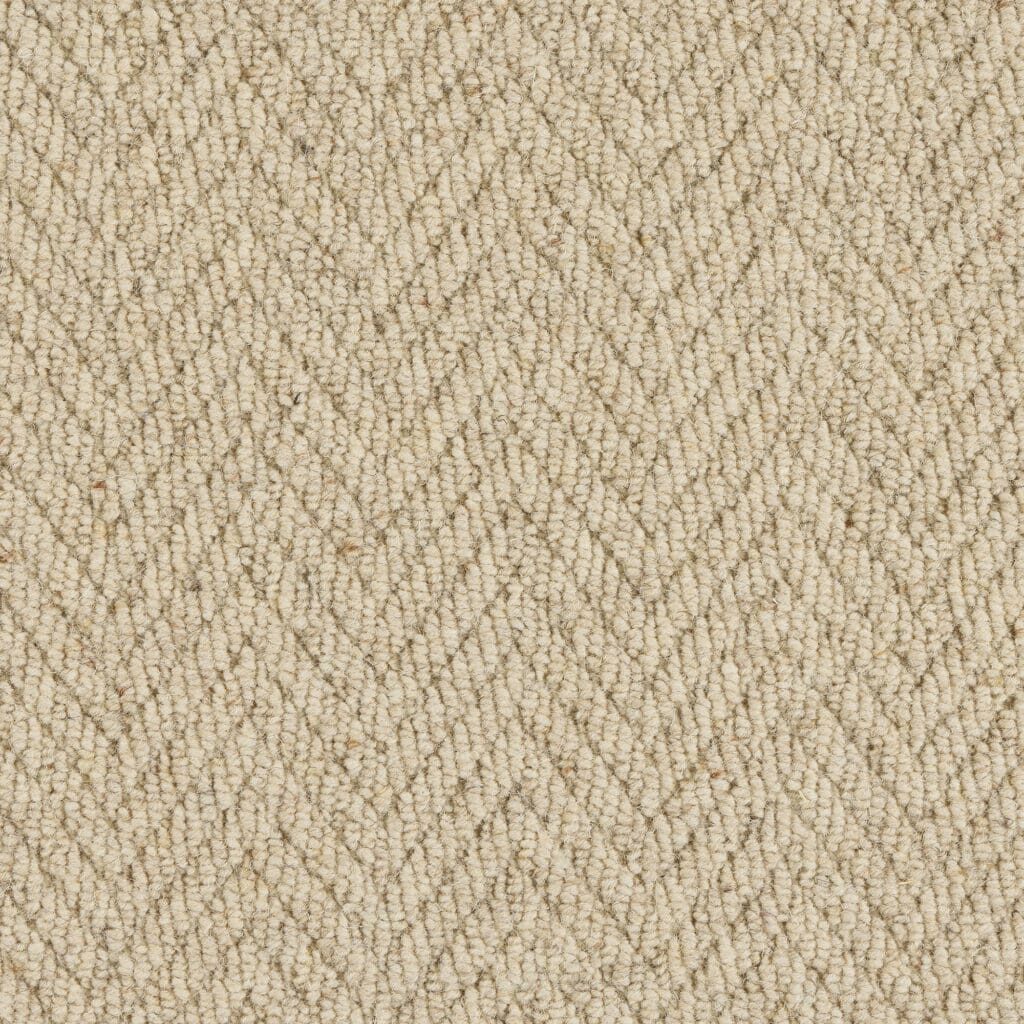 Beige herringbone textured fabric close-up.