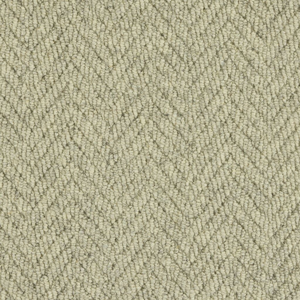 Beige herringbone patterned carpet texture.