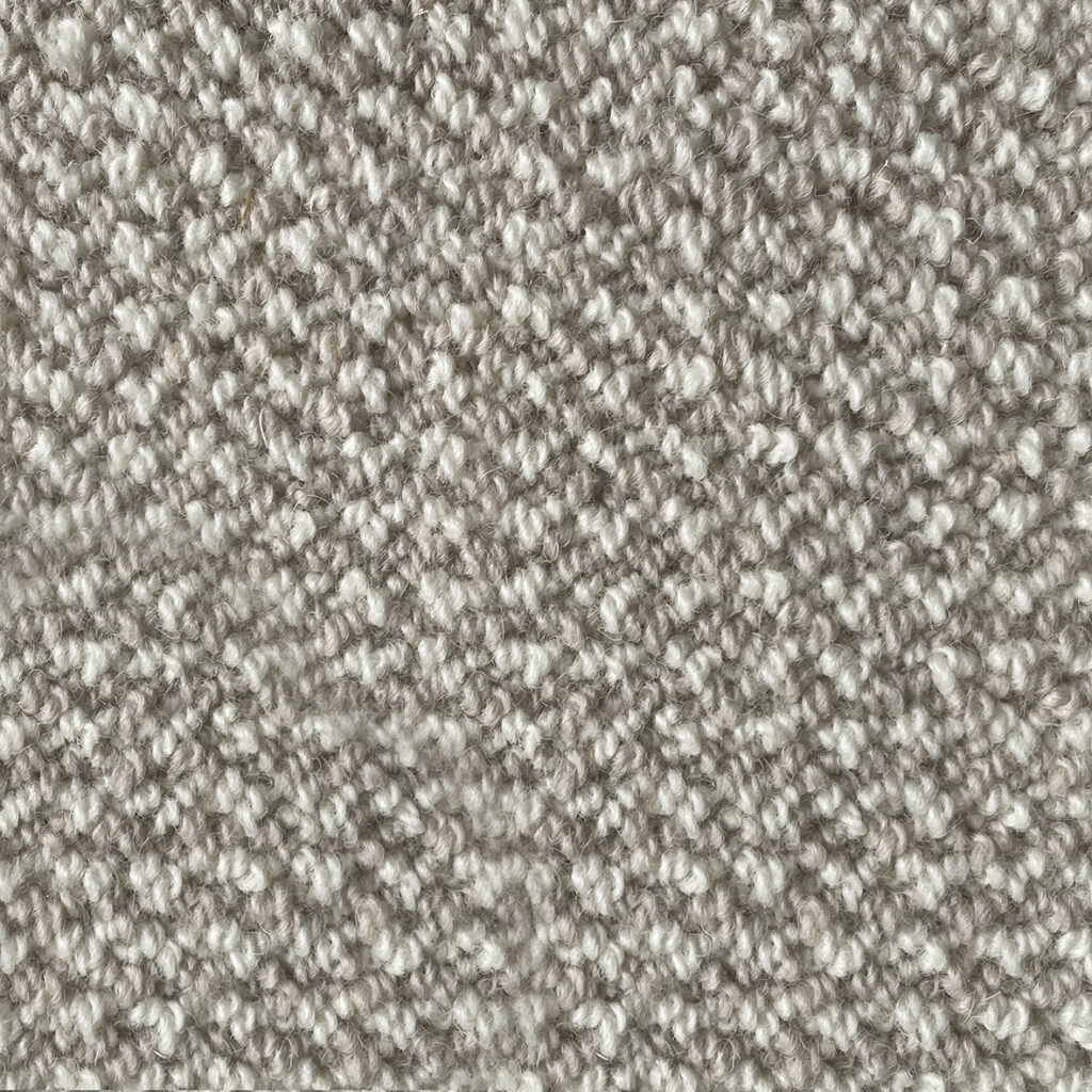 Close-up of textured beige carpet fabric.