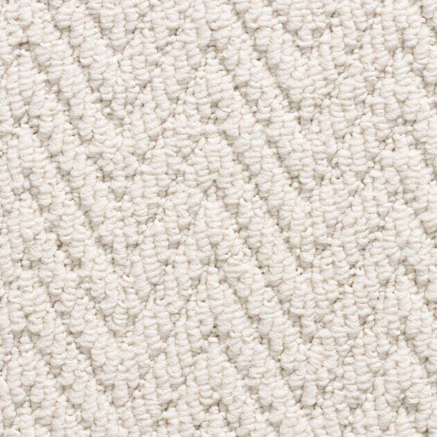 White textured zigzag patterned carpet close-up.