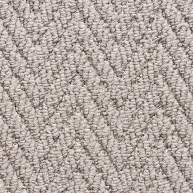 Textured beige carpet with chevron pattern.
