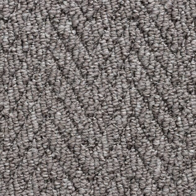 Textured gray carpet with zigzag pattern.