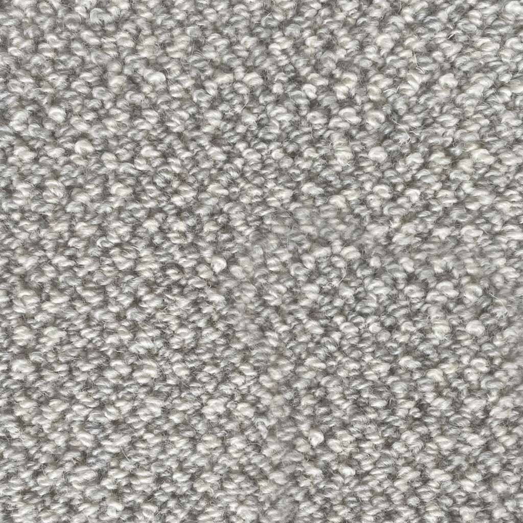 Gray textured carpet with loop pile pattern.