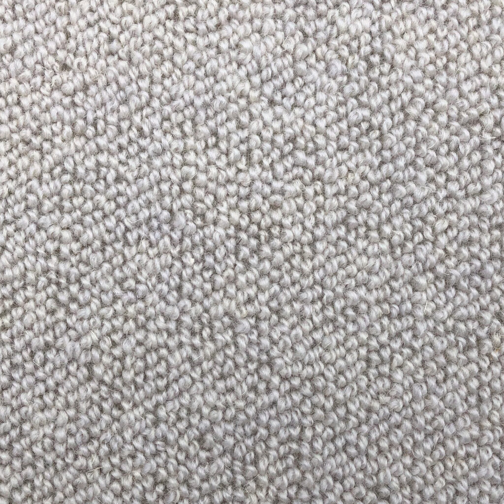 Close-up of beige textured carpet material.