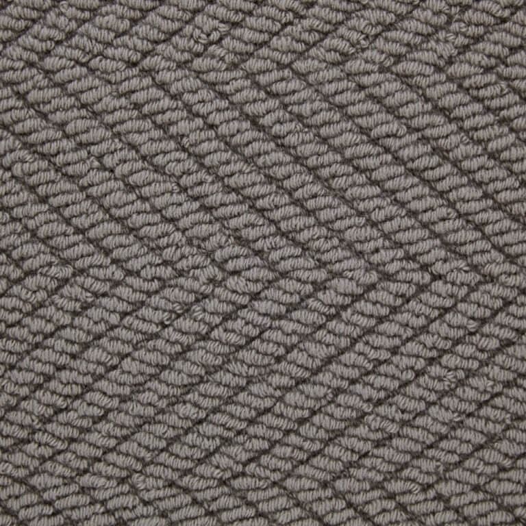 Gray textured zigzag pattern carpet close-up.