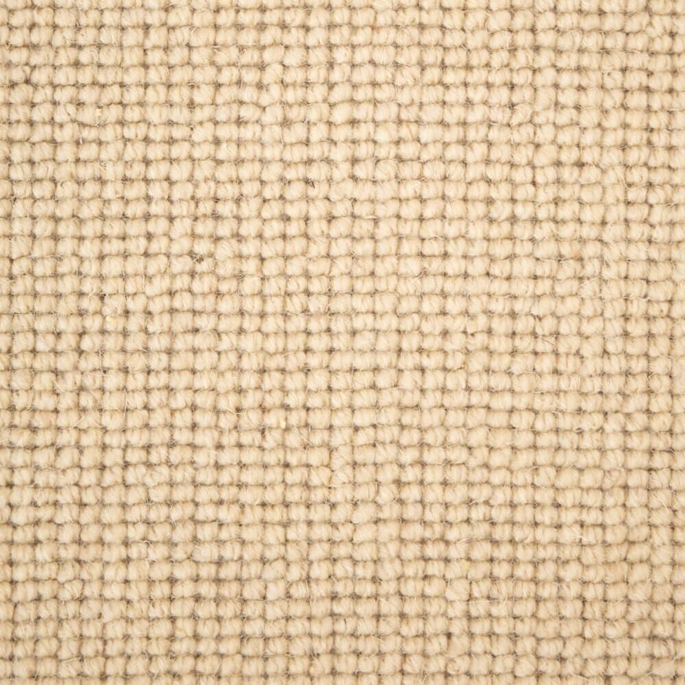 Beige textured woven fabric close-up.
