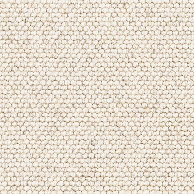 Close-up of cream looped carpet texture