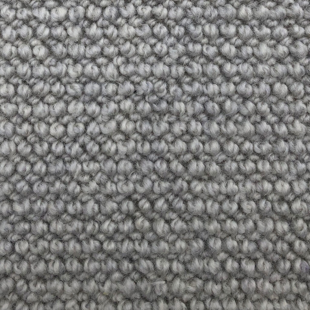Gray textured carpet close-up pattern.
