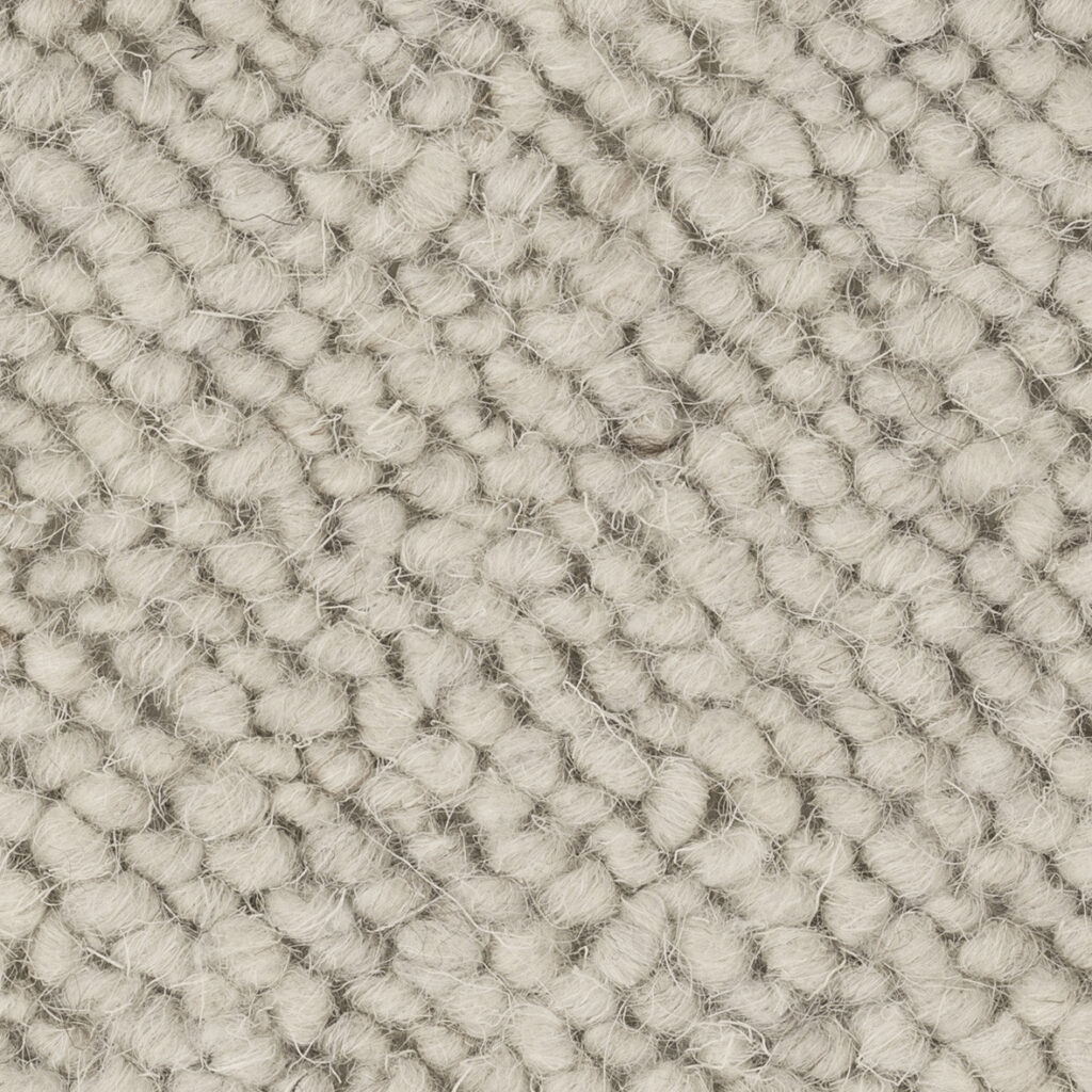 Close-up of textured beige woven fabric.