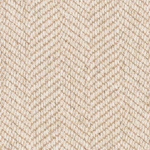 Beige herringbone woven fabric texture.