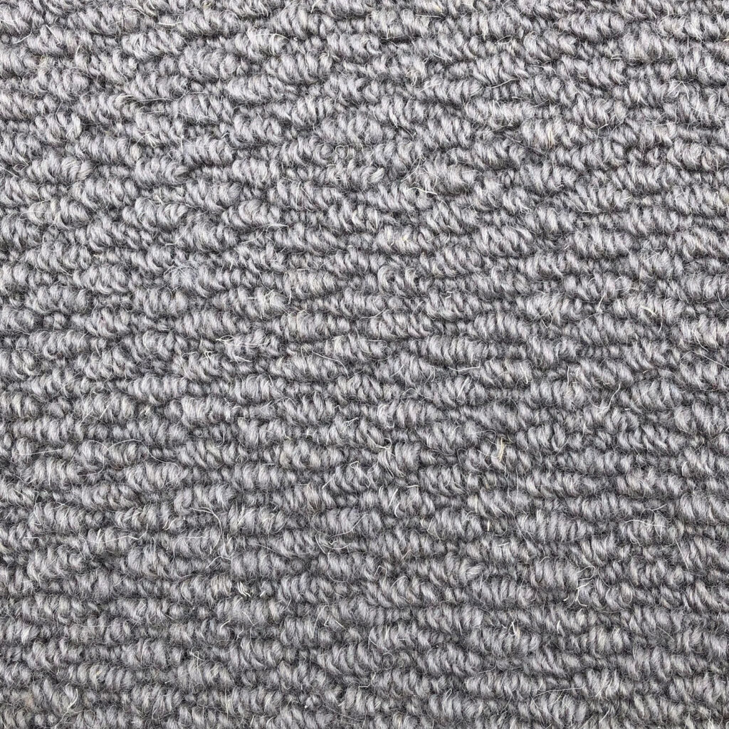 Gray textured carpet close-up view.