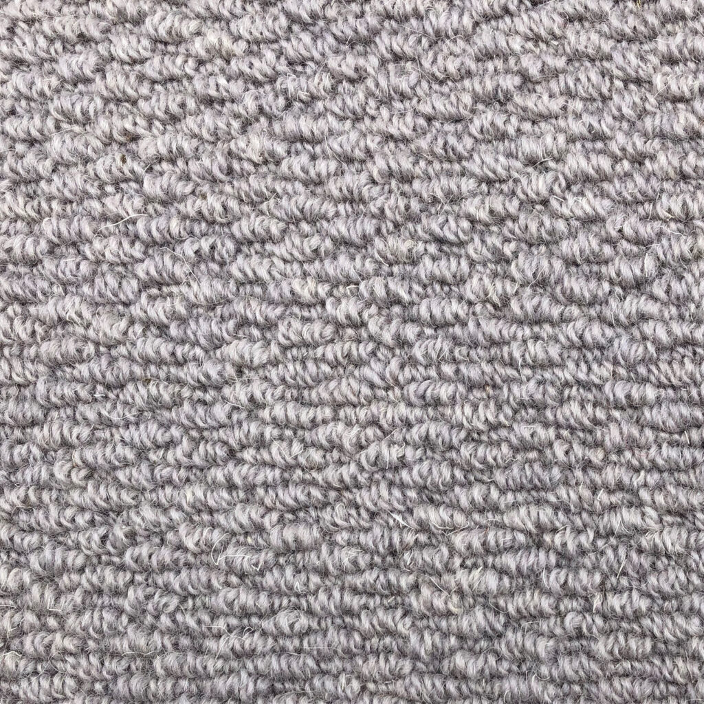Gray textured carpet with looped pattern.